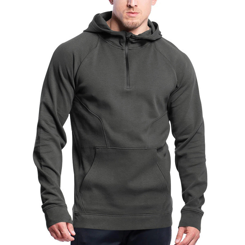 Man wearing a gray hoodie on a white background