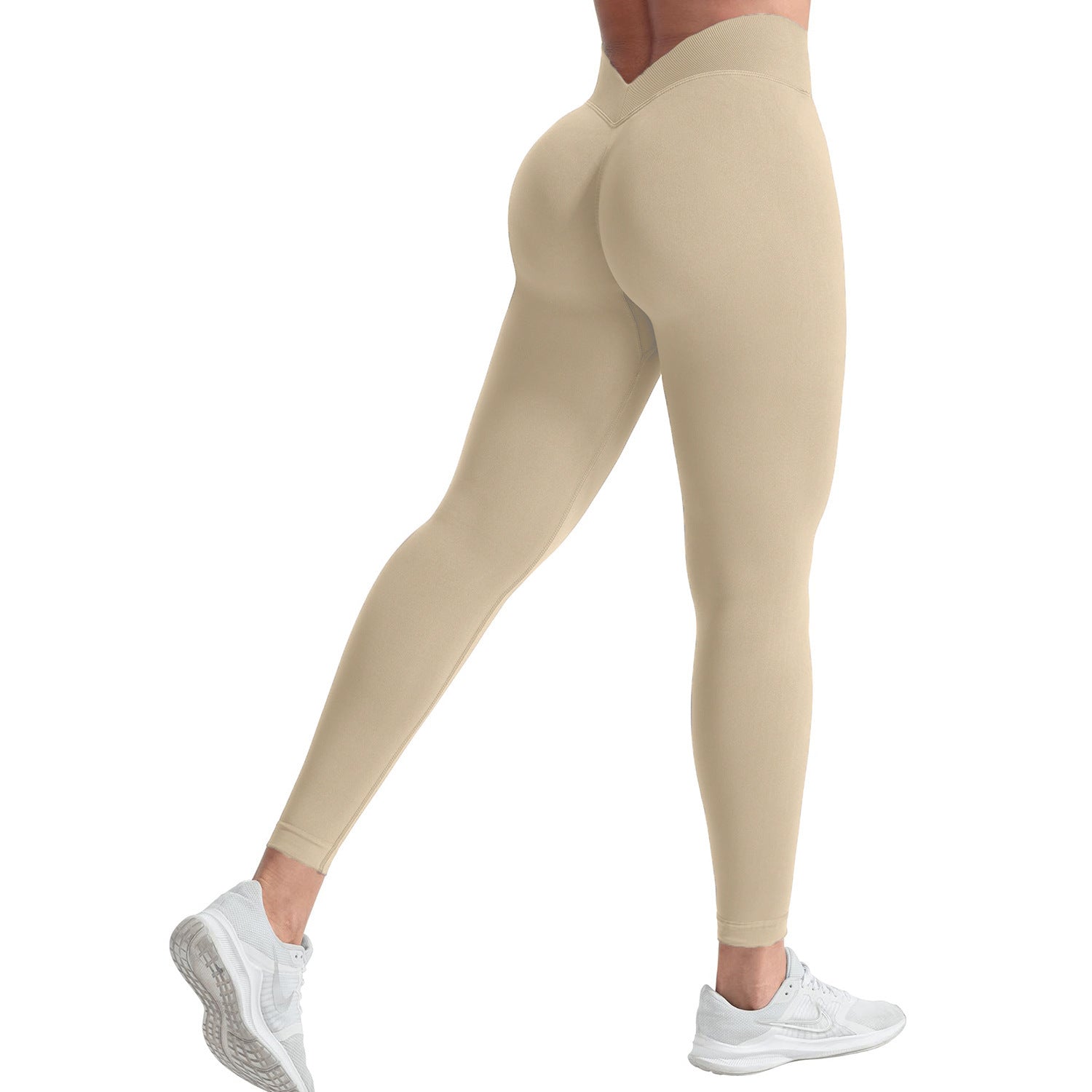 Beige leggings worn by a person on a white background