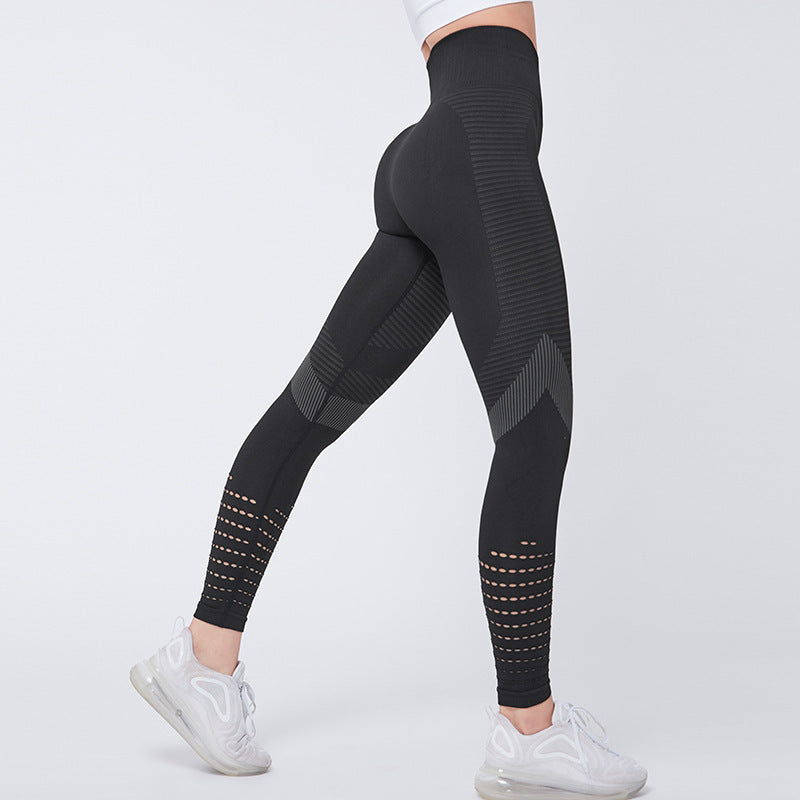 Black leggings with geometric patterns worn by a person on a white background