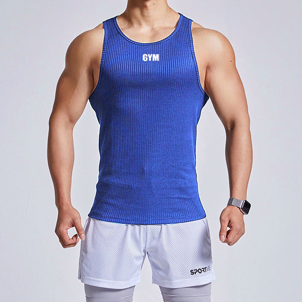 Person wearing a blue 'GYM' tank top and white shorts on a light gray background