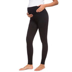 Person wearing black leggings on a white background