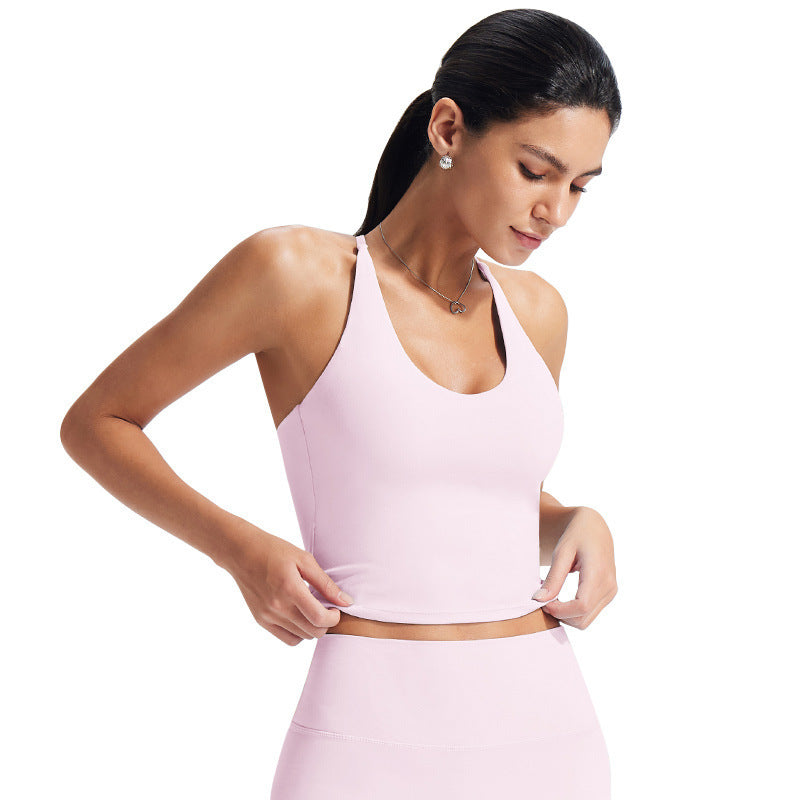 Woman wearing a pink athletic outfit on a white background