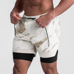 Person wearing camouflage shorts with a white background