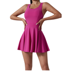 Pink dress worn by a model on a white background