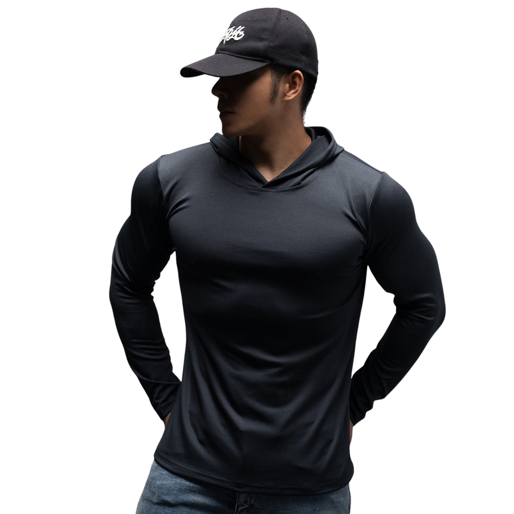 Person wearing a black long-sleeve hoodie and cap on a white background