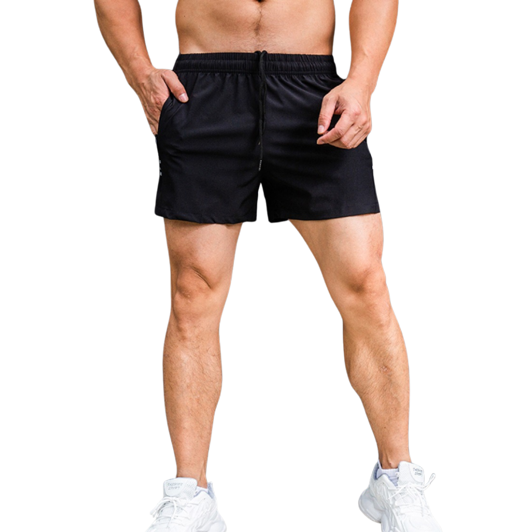 Person wearing black shorts on a white background
