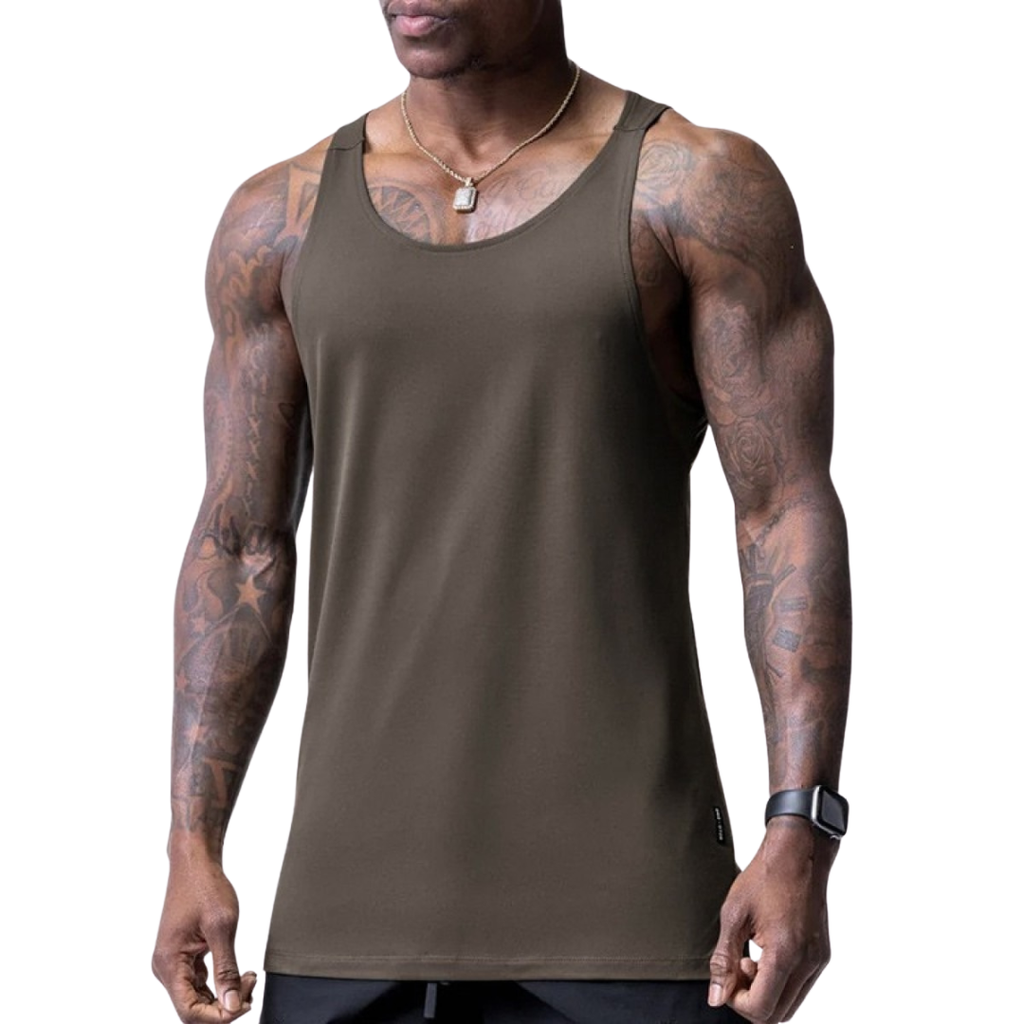 Man wearing a brown tank top with tattoos on arms against a white background