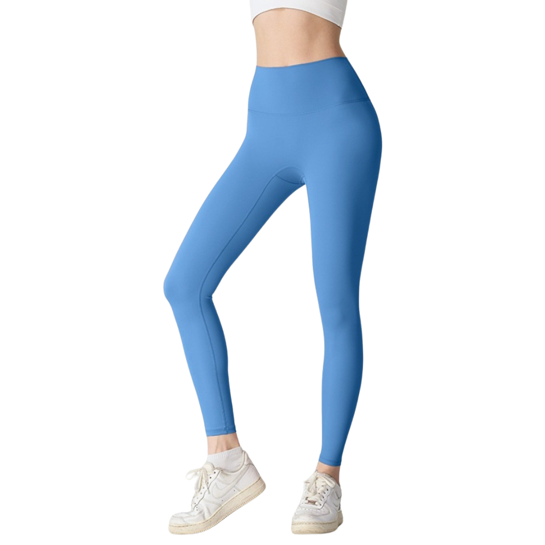 Blue leggings worn by a person on a white background