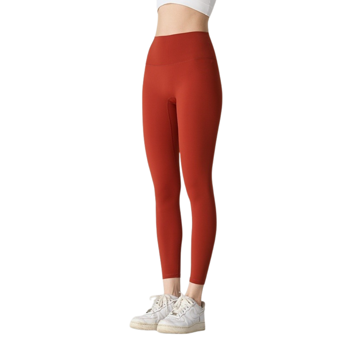 Red leggings worn by a person on a white background
