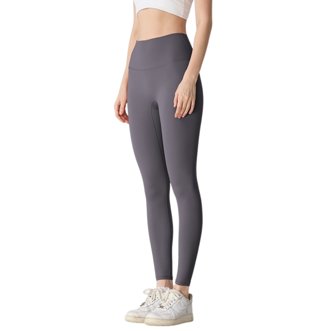 Person wearing gray leggings on a white background
