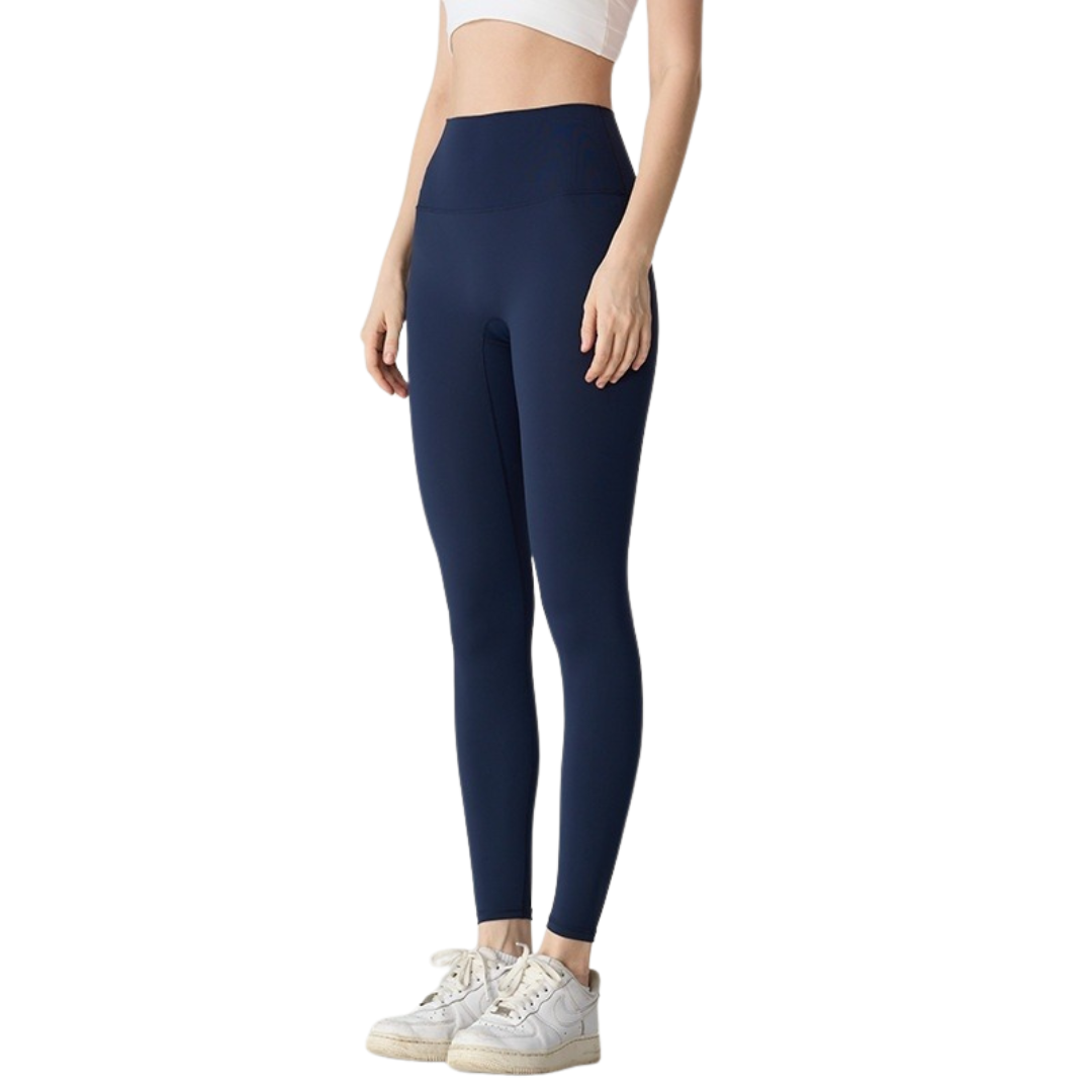 Navy blue leggings worn by a person on a white background