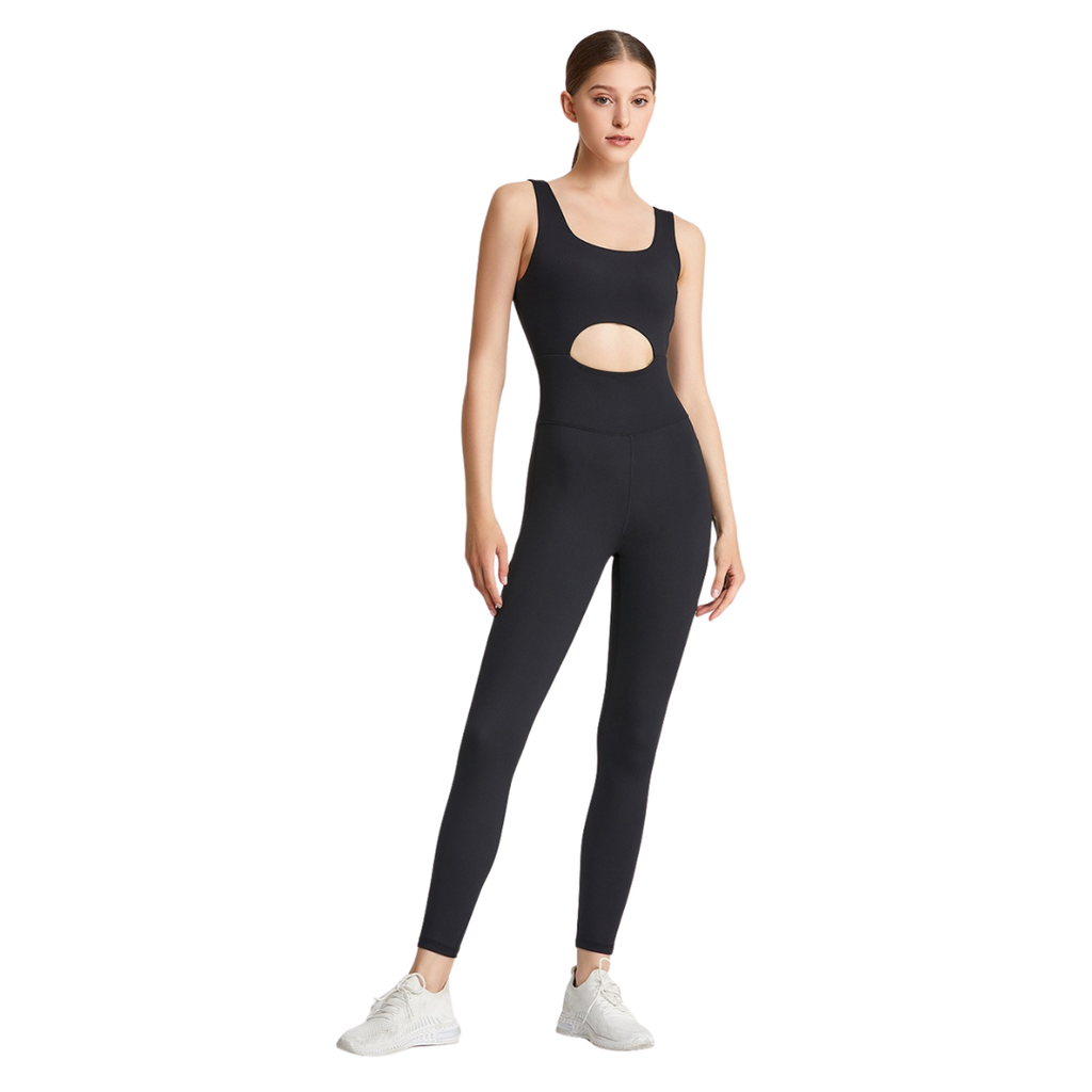 Woman wearing a black athletic outfit with cut-out design on a white background