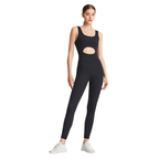 Woman wearing a black athletic outfit with cut-out design on a white background