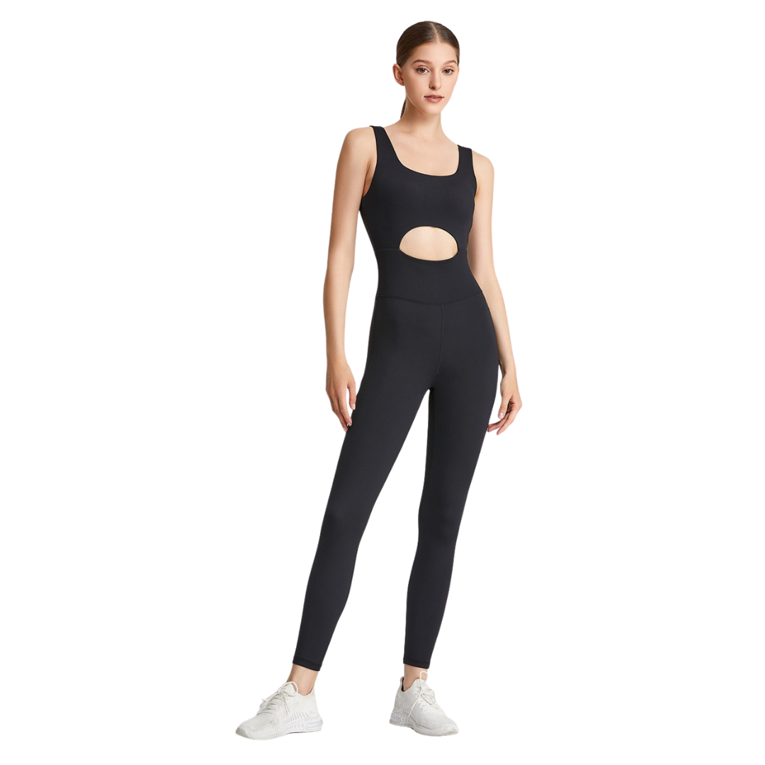 Woman wearing a black athletic outfit with cut-out design on a white background