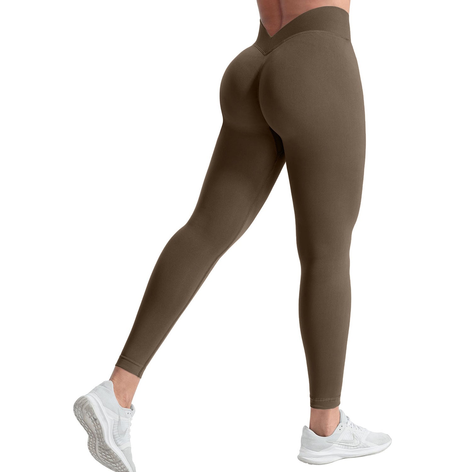Brown leggings worn by a person on a white background