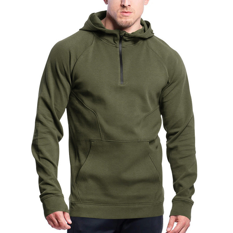 Green hoodie worn by a person on a white background