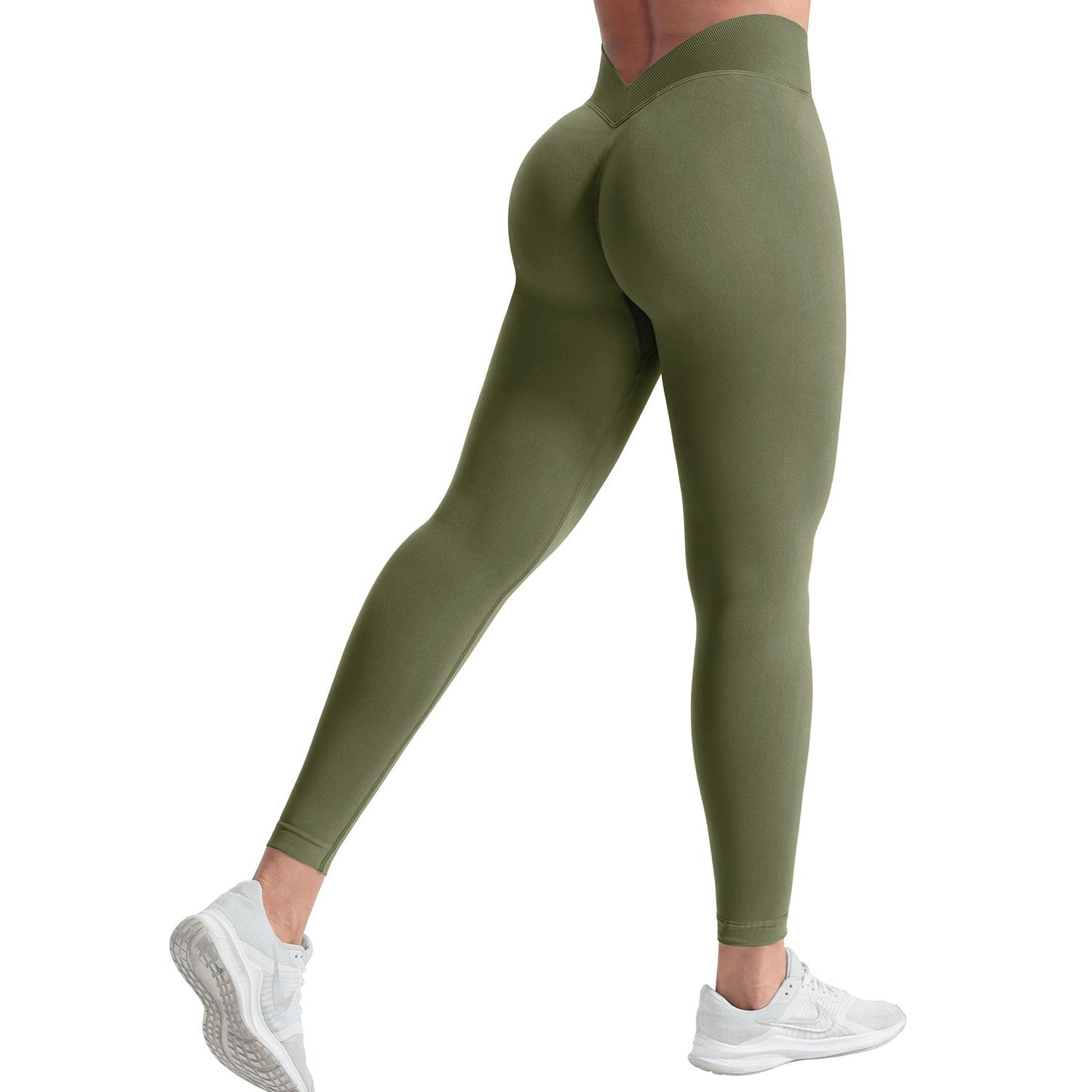 Green leggings worn by a person on a white background
