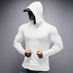 Person wearing a white hoodie against a gray background